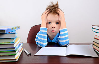 Boy surrounded by books
